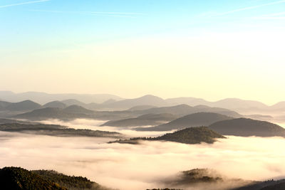 Scenic view of silhouette mountains against sky during sunset