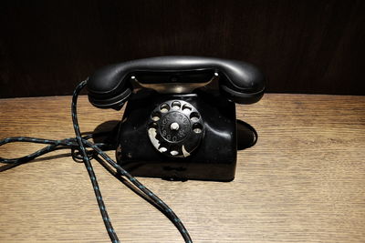 Telephone on wooden table