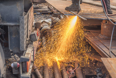 Low section of man working at factory