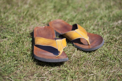 Close-up of shoes on field