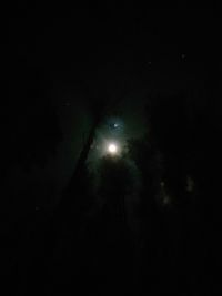 Low angle view of moon in sky at night