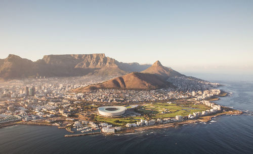 High angle shot of town against mountains