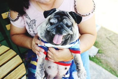 Midsection of woman with dog