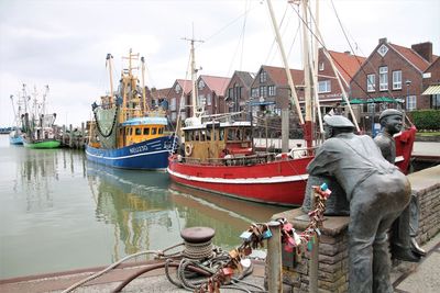 Boats moored at harbor