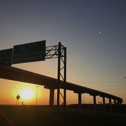 Low angle view of built structure against sky at sunset