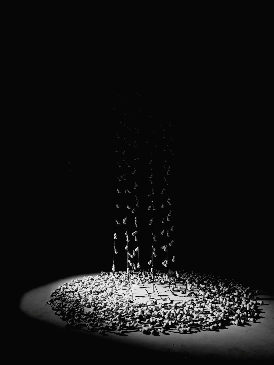 CLOSE-UP OF DROP SPLASHING ON BLACK BACKGROUND