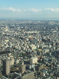 High angle view of buildings in city against sky