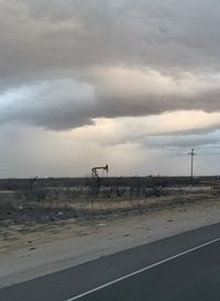 View of horse on road against sky