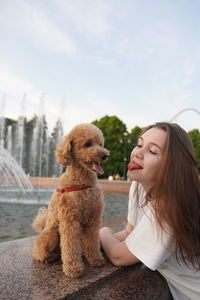 Portrait of woman with teddy bear