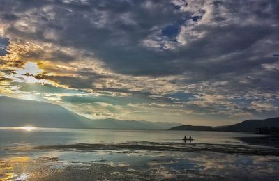 Scenic view of sea against cloudy sky