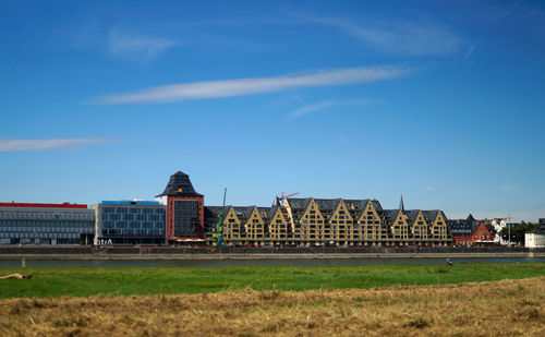 Buildings against blue sky and clouds