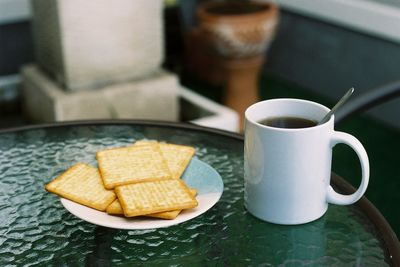 Close-up of coffee cup on table