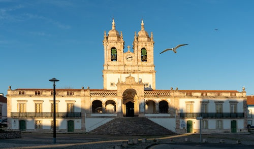 Facade of historic building against sky