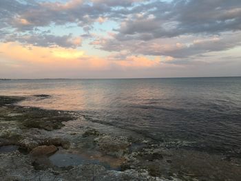 Scenic view of sea against dramatic sky