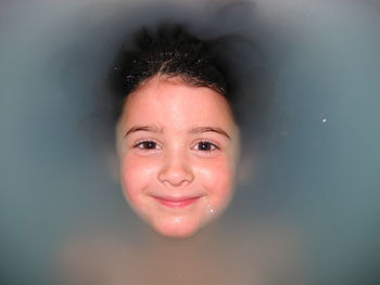 Close-up portrait of smiling girl