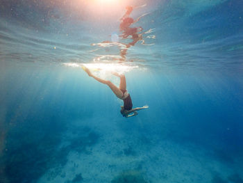 Woman swimming in sea