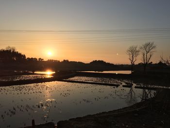 Scenic view of sunset over river