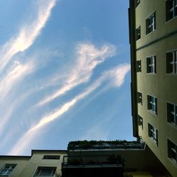 Low angle view of building against cloudy sky