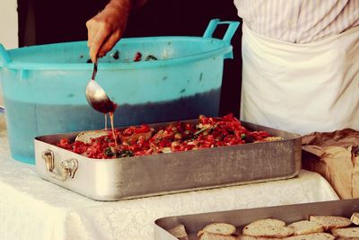 Close-up of man preparing food