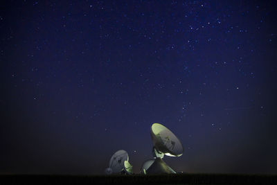 Satellite against star field at night