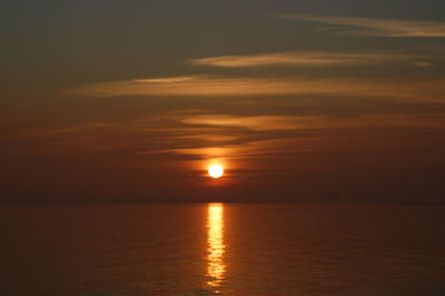 Scenic view of sea against romantic sky at sunset