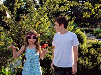 Full length of a smiling girl with plants