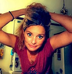 Portrait of a smiling young woman at home