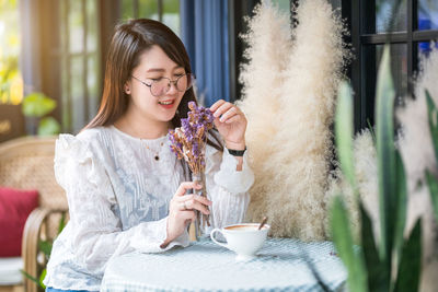 Young woman sitting at restaurant