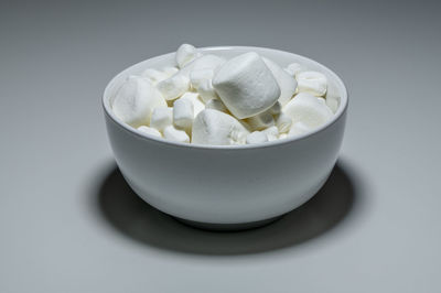Close-up of cup of bowl on table