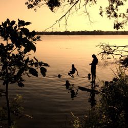 Scenic view of calm lake at sunset