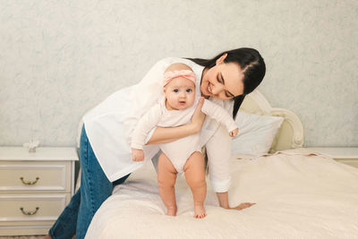 Mother and son on bed