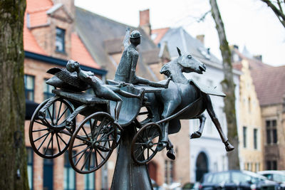 Statue against building