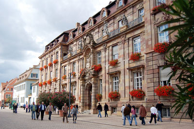 People walking in front of building