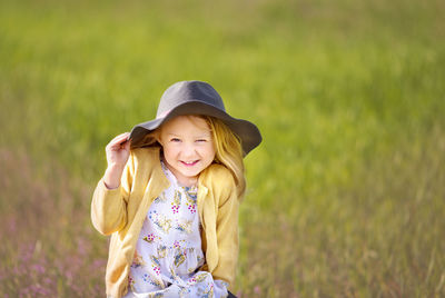 Young woman standing on field