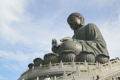 Low angle view of statue against sky