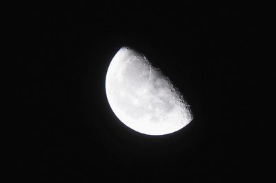 Low angle view of moon against sky at night