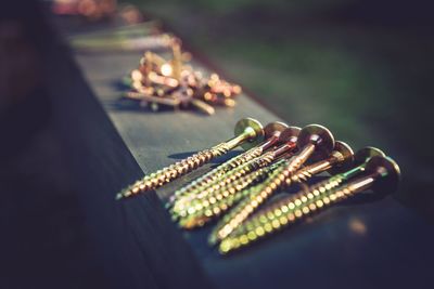 Close-up of screws on table