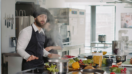 Portrait of chef working in kitchen