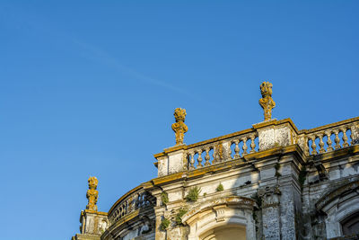 Low angle view of building against blue sky