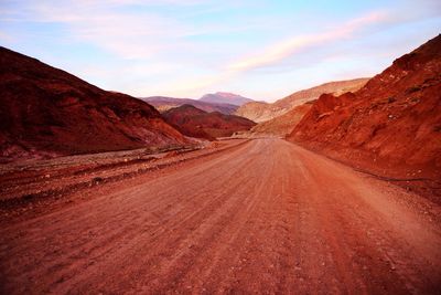 Empty road along rocky landscape