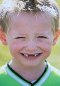 Close-up portrait of smiling boy