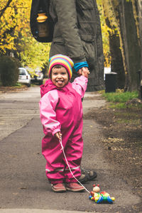 Portrait of girl playing with umbrella