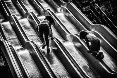 High angle view of people walking on staircase