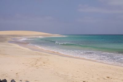 Scenic view of beach against sky