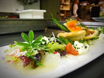 Close-up of food on plate in commercial kitchen at restaurant