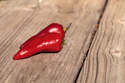 Close-up of red chili on table