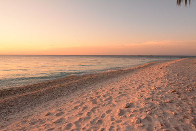 Scenic view of sea against clear sky during sunset