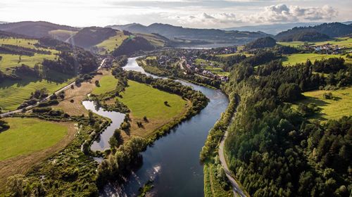 High angle view of river amidst landscape against sky