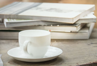 Close-up of coffee cup on table