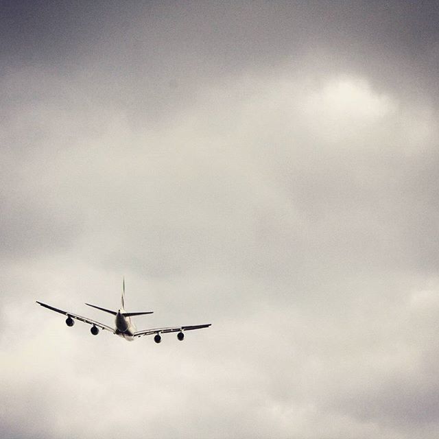 airplane, air vehicle, mode of transport, transportation, flying, low angle view, sky, cloud - sky, mid-air, on the move, travel, public transportation, journey, cloudy, outdoors, cloud, helicopter, airways, aircraft, aircraft wing